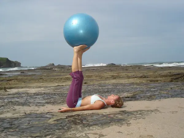 woman doing pilates with ball