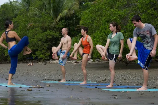 Partiipants are practicing physical posture in sea beach