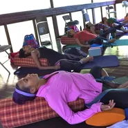 Participants are relaxing in Marianne Wells Yoga School