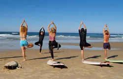 practicing yoga on surfing boats