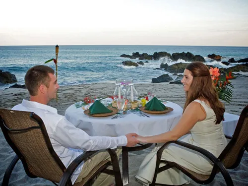 couple having launch beside sea beach