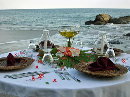 beautifully decorated dining table beside sea beach