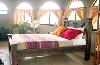 bed room with king size bed and windows