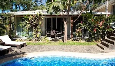 swimming pool beside Gold Deluxe Family Lodging