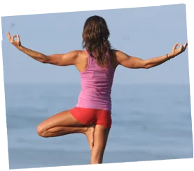 woman doing yoga in front of deep blue sea