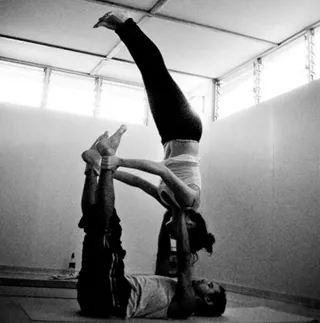 practicing couple yoga at zen yoga studio