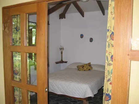 provate room with queen size bed at Panacea de la Montaña