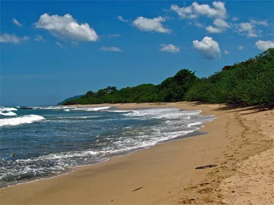 a beautiful tamarindo sea beach under the blue sky