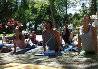 group of people practicing outdoor yoga