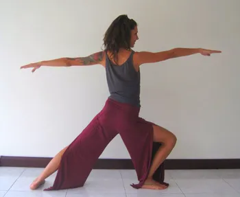 woman practicing warrior pose