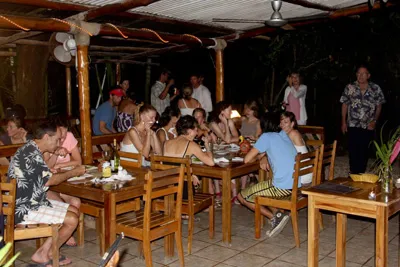 people enjoying dinner at beach dog cafe