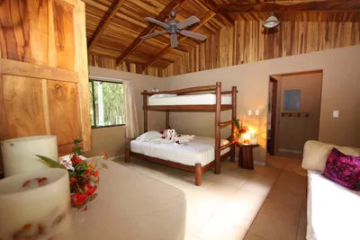 Hotal room with two beds, large window and attached bath