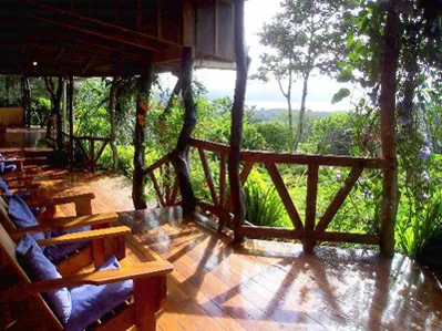 large terrace with wooden chairs