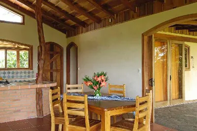 small wooden dining table with chairs in a beautifully decorated dining room