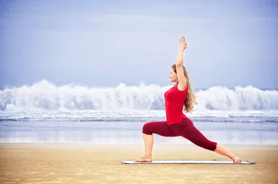woman practicing warrior pose