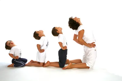 kids with mom practicing back-bending