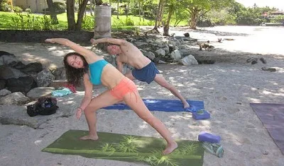 Couple practicing outdoor yoga