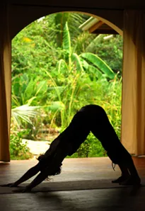 Woman practicing Downward Dog Pose