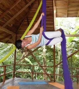 Woman-doing-aerial-yoga-at-
