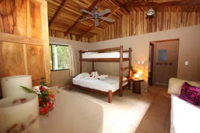 Hotal room with two beds, large window and attached bath